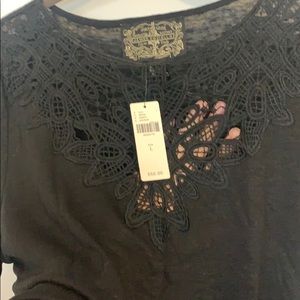 Short-sleeve black t-shirt/blouse.